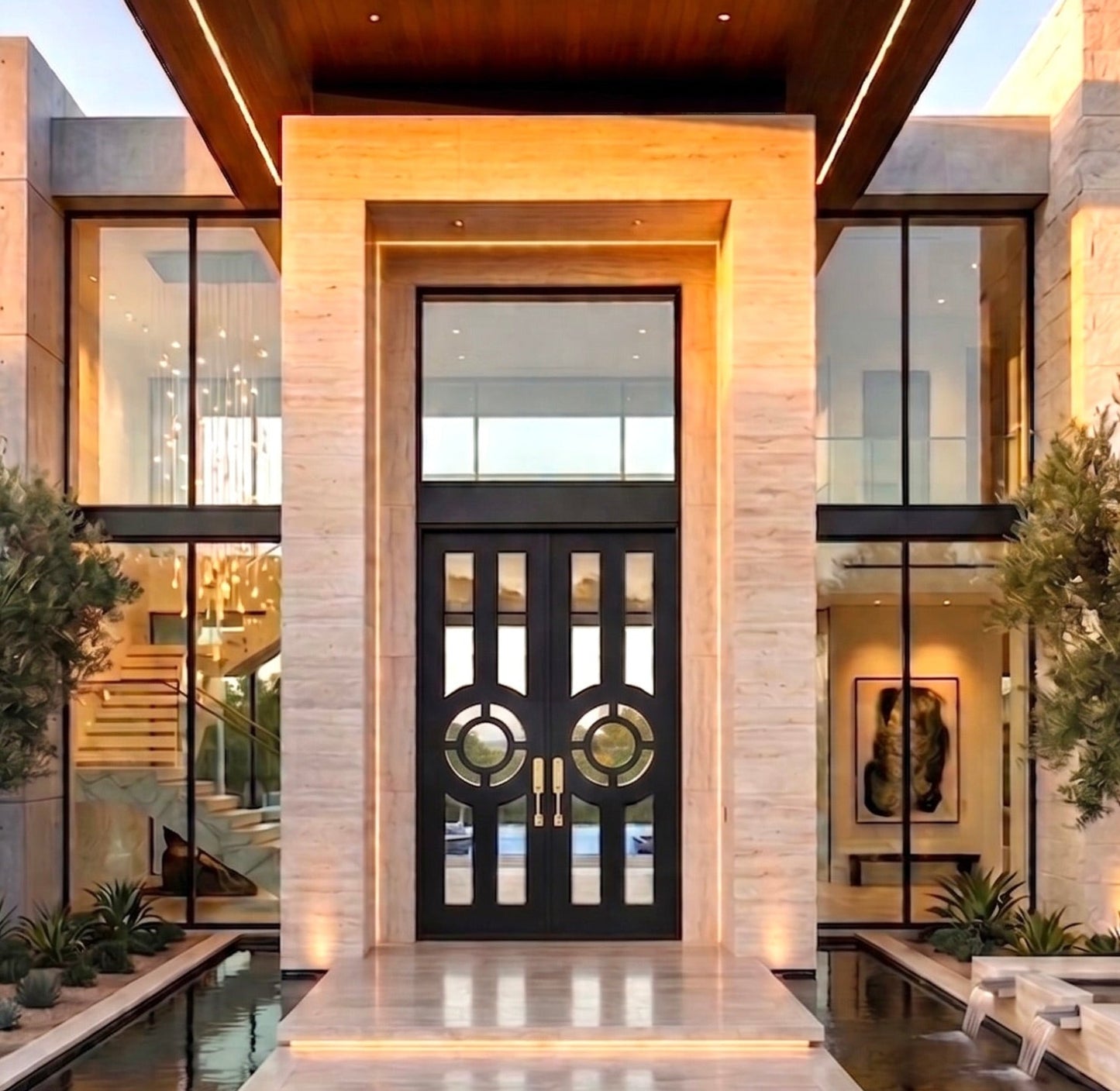 Modern house entrance with a black door and stone facade