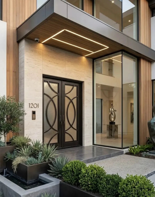 Modern house entrance with glass doors and decorative plants